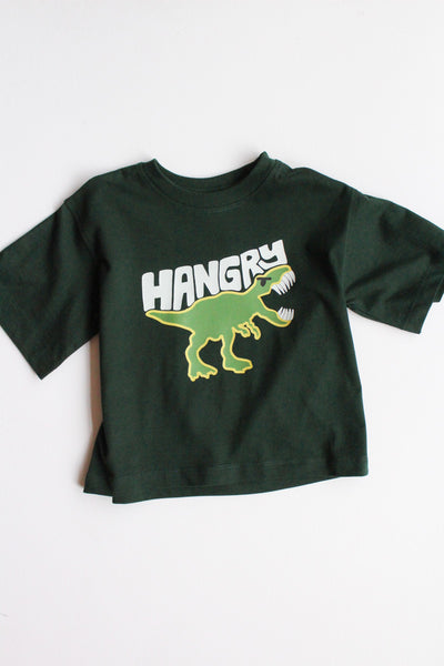 Green children's shirt with a dinosaur graphic and 'HANGRY' text on a white background