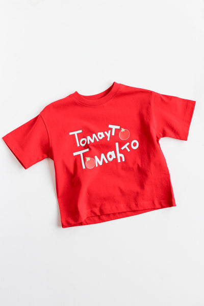 Red t-shirt with tomayto tomahto graphic on a white background