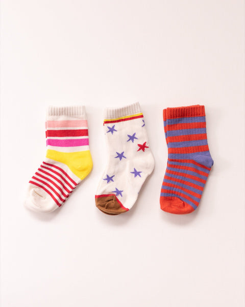 Three pairs of colorful socks on a white background