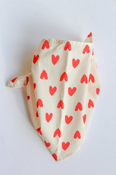 off white bandana with red heart pattern on a white background