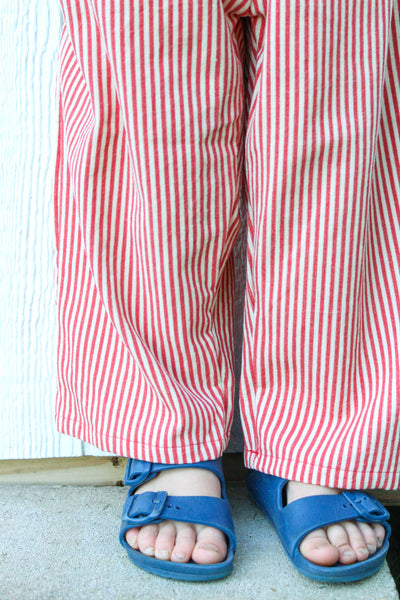 close up of our red and cream striped corduroy pants with wide-leg fit