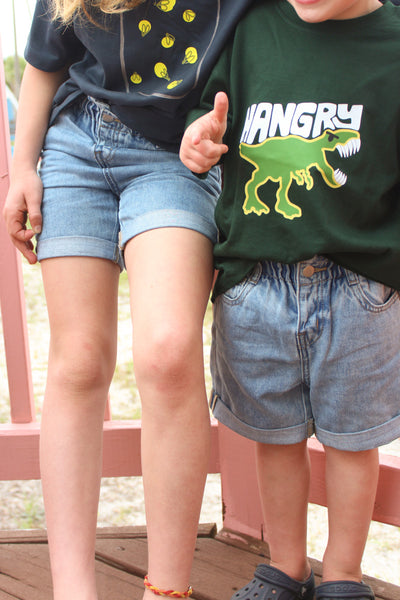 little girl and little boy wearing denim shorts 