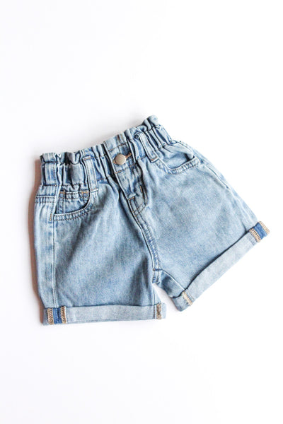 Light blue denim shorts on a white background