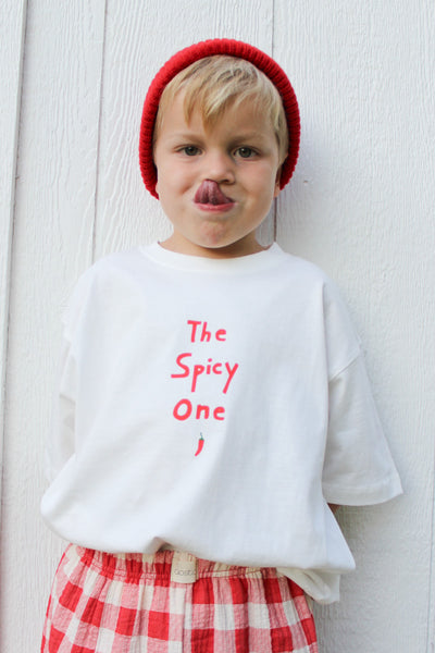t-shirt tucked into red gingham pants 
