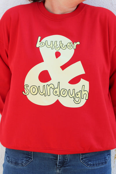 Women’s red cotton sweatshirt with a hand-drawn sourdough and butter graphic