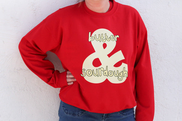 Women’s red cotton sweatshirt with a hand-drawn sourdough and butter graphic