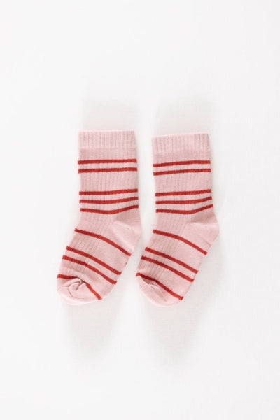 A pair of pink socks with red stripes, displayed against a white background.