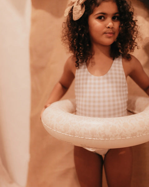 child using inflatable ring 