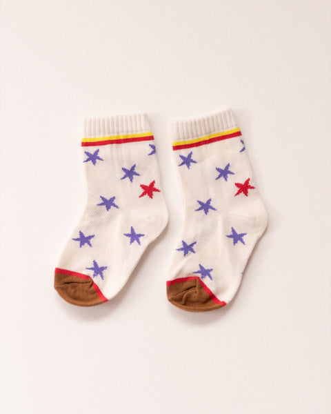 Pair of socks with star patterns on a light background