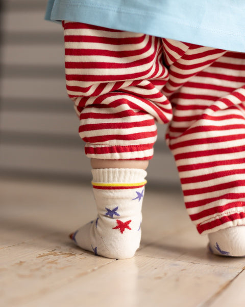 toddler baby wearing cream star socks 