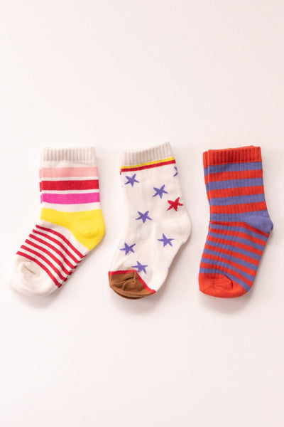 Three pairs of colorful socks with different patterns on a white background for kids, toddler, and baby