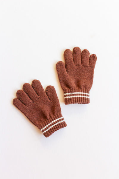Pair of brown gloves with white stripes on a light beige background