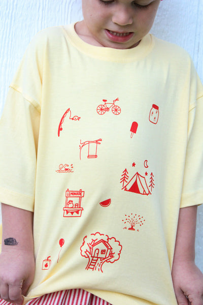 Kids yellow cotton t-shirt with hand-drawn orange childhood doodles on front and Long live childhood graphic on back