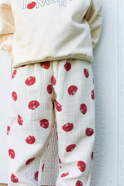Kids cream cotton muslin pants with red tomato print and elastic waist