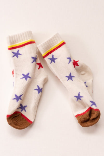Pair of socks with star patterns on a light background