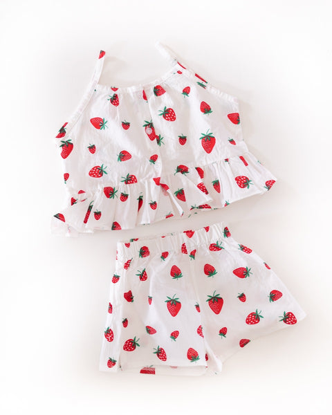 Strawberry-patterned top and shorts set on a white background