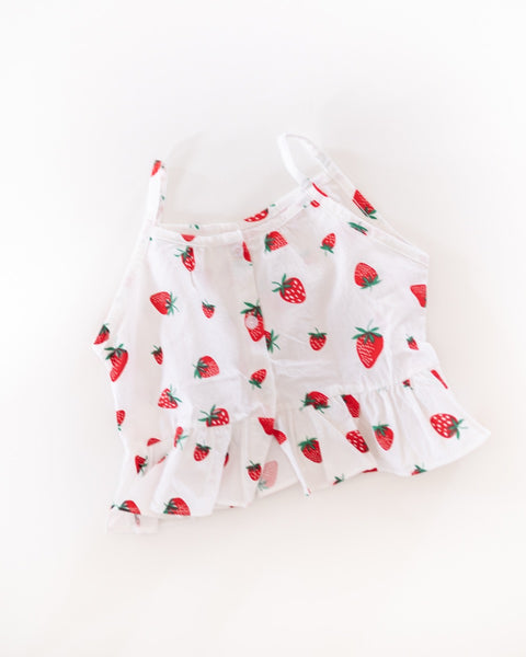 White tank top with red strawberry pattern on a white background