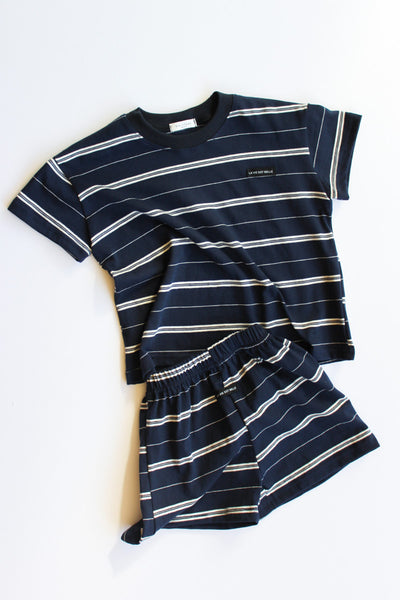 Navy and white striped t-shirt and shorts set on a white background