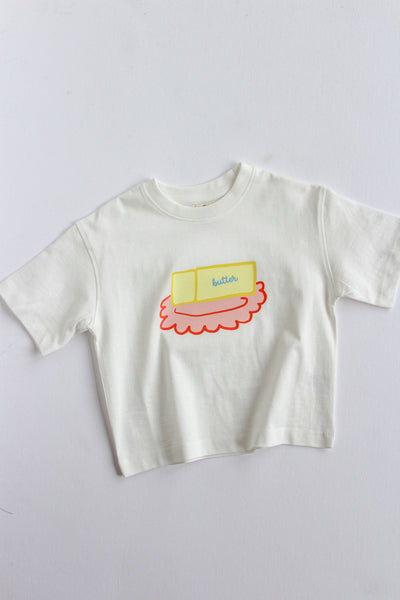 White t-shirt with a butter dishl graphic on a white background