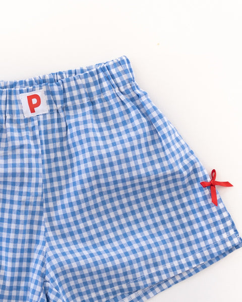 Blue and white gingham checkered women's shorts with red bow accents