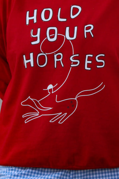 Red sweatshirt with 'Hold Your Horses' text and horse graphic